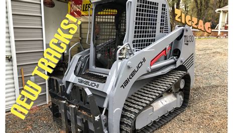 putting tracks back on skid steer|changing tracks on skid steer.